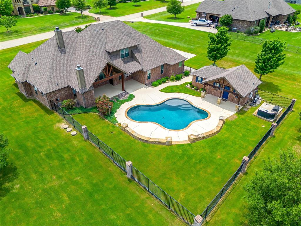 160 Solano Circle Aledo, TX 76008 - Photo 1 of 1 a aerial view of a house with swimming pool and yard