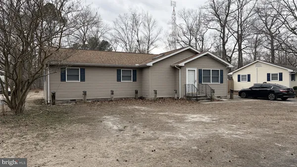 a view of a house with a yard and garage