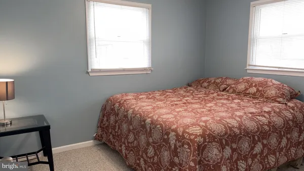 a bathroom with a toilet and a shower curtain