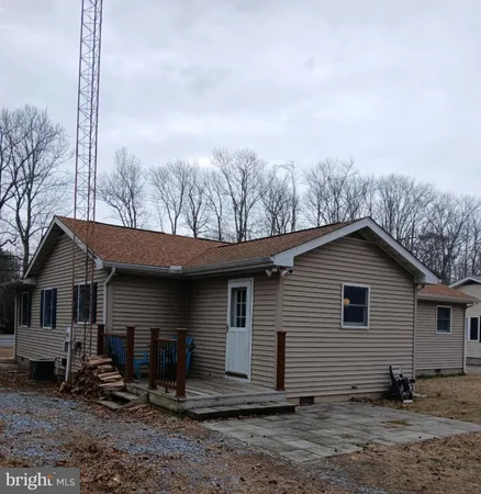 a house with trees in the background