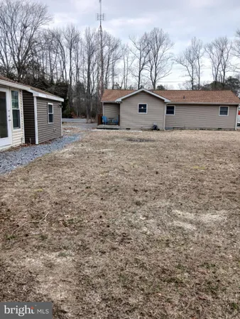 a small white house with a white door