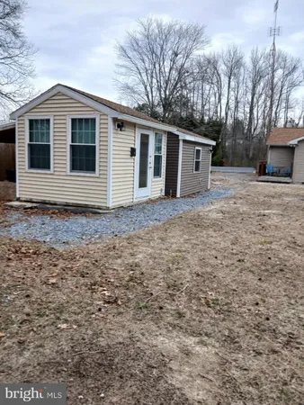 a view of a house with a yard and garage