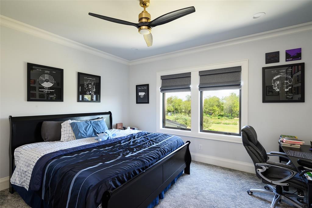 635 Highpoint Road Royse City, TX 75189 - Photo 21 of 35 a bedroom with a large bed and a desk