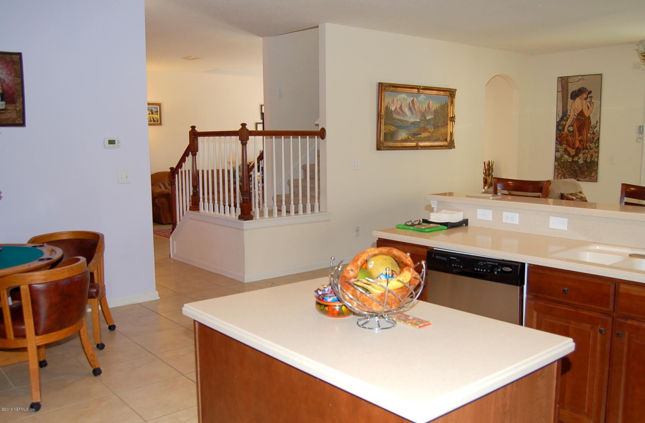 390 Porta Rosa Circle St. Augustine, FL 32092 - Photo 11 of 36 Kitchen to stairs and living room