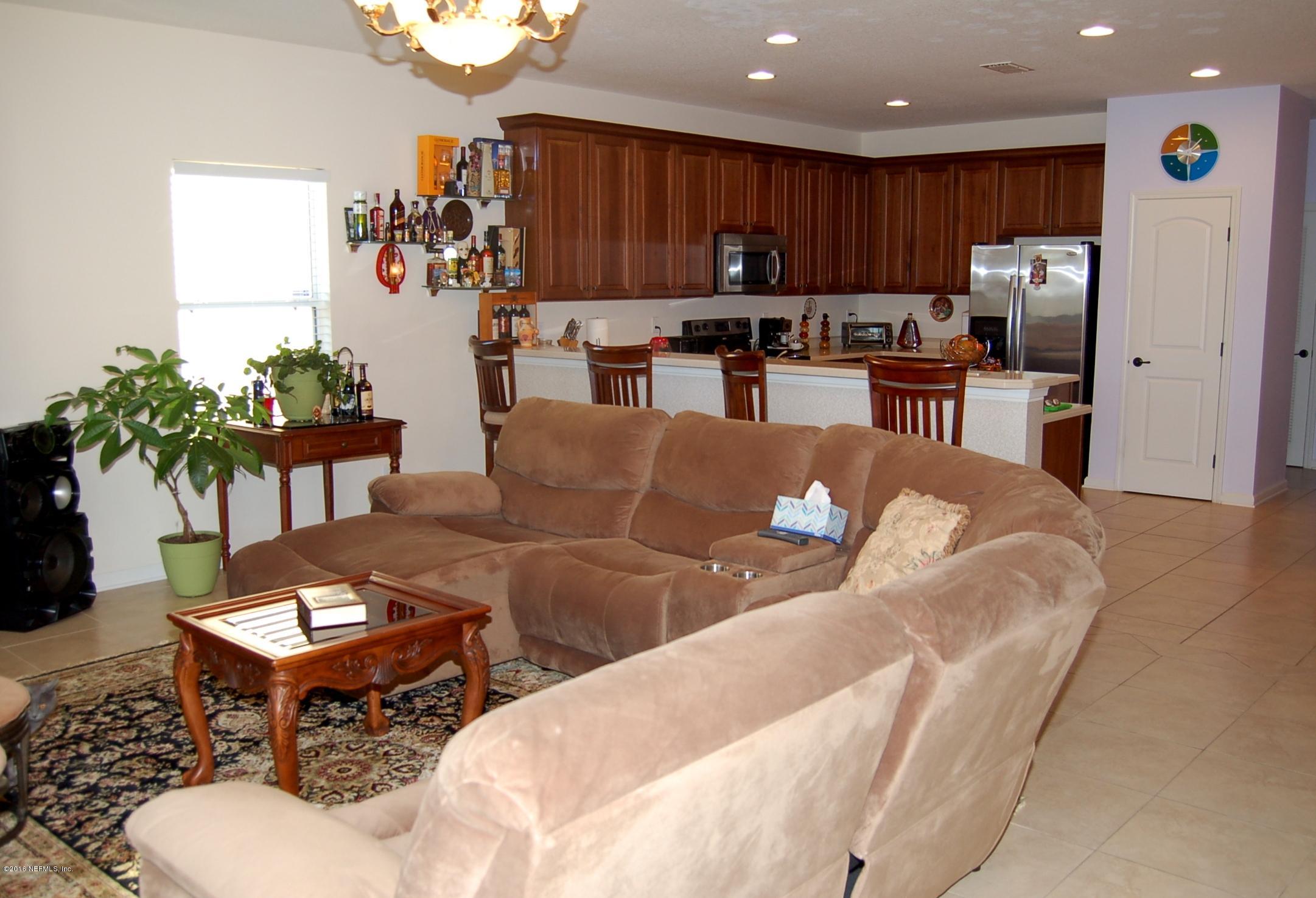 390 Porta Rosa Circle St. Augustine, FL 32092 - Photo 15 of 36 Family room to kitchen