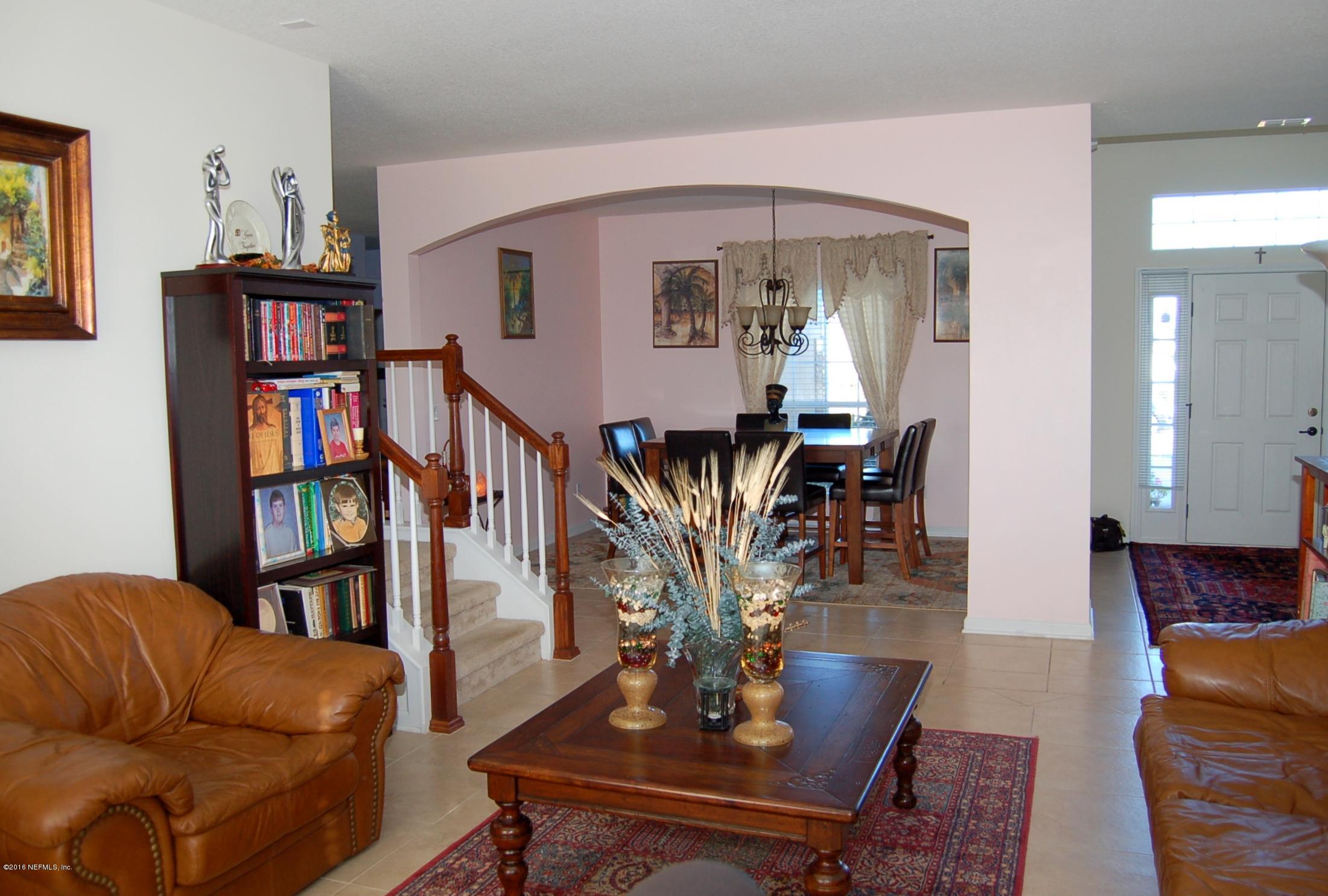 390 Porta Rosa Circle St. Augustine, FL 32092 - Photo 9 of 36 Living room to dining and foyer