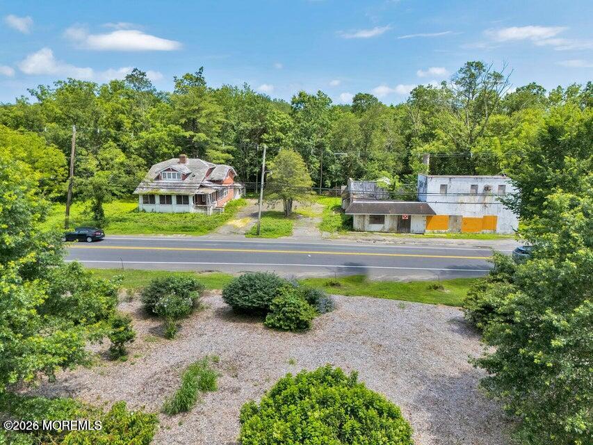 465 Lakewood Farmingdale Road Howell, NJ 07731 - Photo 2 of 19 a view of a swimming pool with a yard