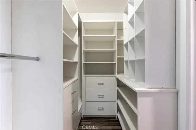a view of an empty walk in closet