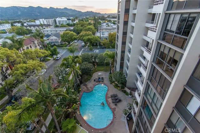 an aerial view of a residential houses with outdoor space