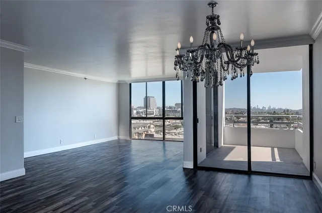 a view of a room with wooden floor and balcony