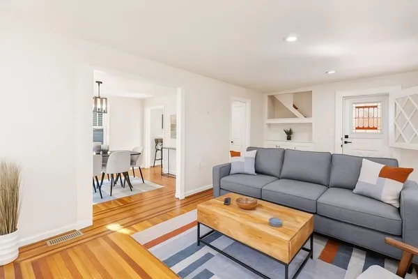 a living room with furniture and a table