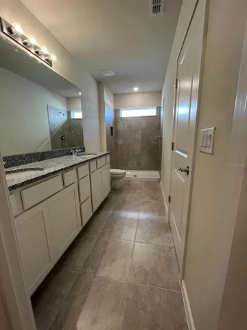 a bathroom with a sink and mirror