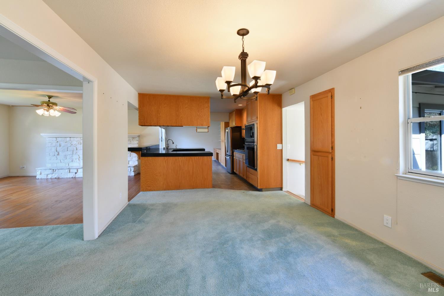 135 Fulton Place Windsor, CA 95492 - Photo 23 of 41 a view of a kitchen with a sink a refrigerator and windows
