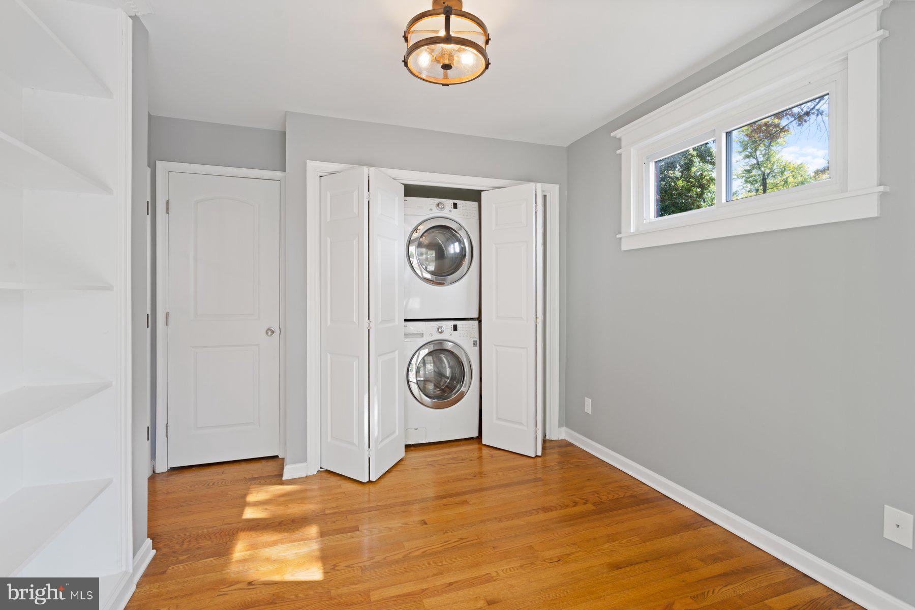 27 Edgemoor Road Lutherville-Timonium, MD 21093 - Photo 17 of 42 a view of a hallway with a washer and dryer