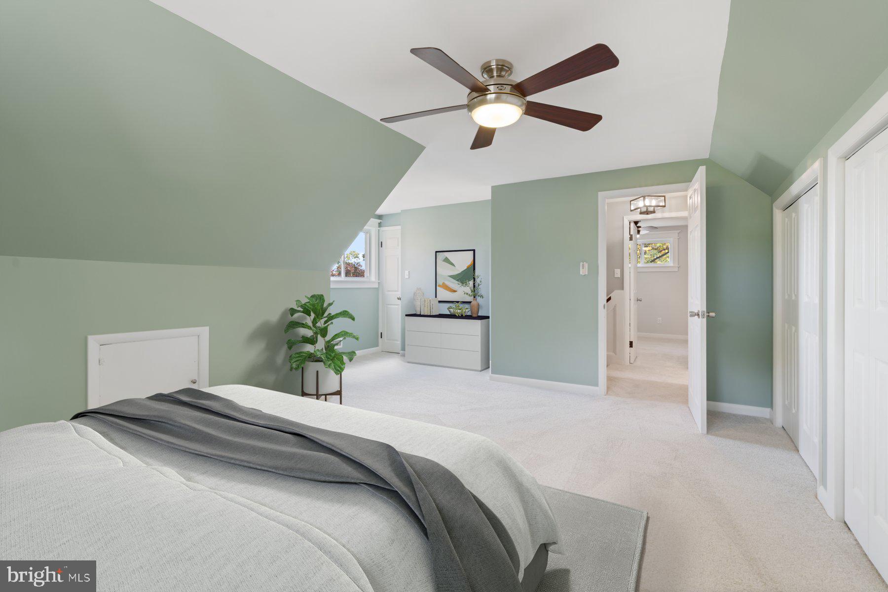 27 Edgemoor Road Lutherville-Timonium, MD 21093 - Photo 19 of 42 a bedroom with a large bed and a chandelier