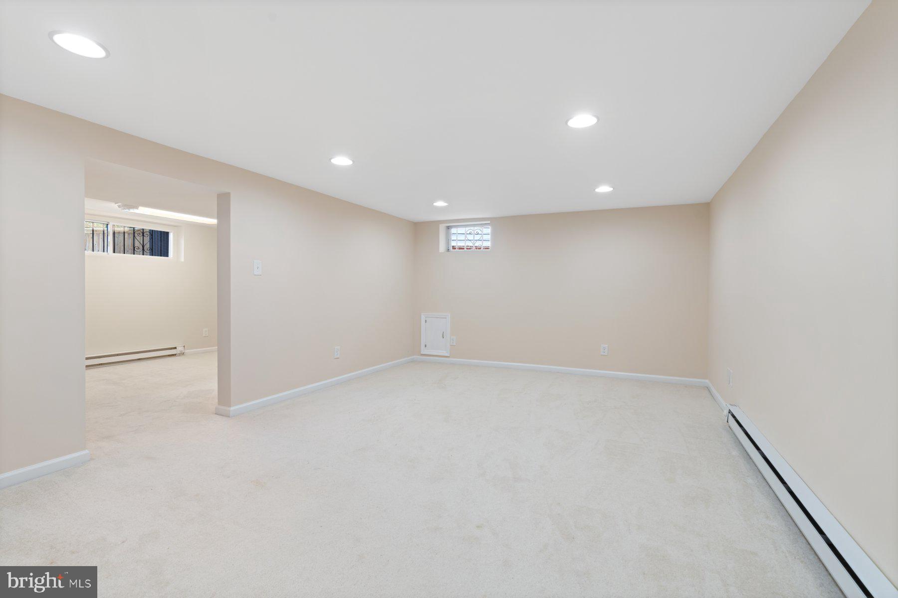 27 Edgemoor Road Lutherville-Timonium, MD 21093 - Photo 28 of 42 wooden floor in an empty room with a window