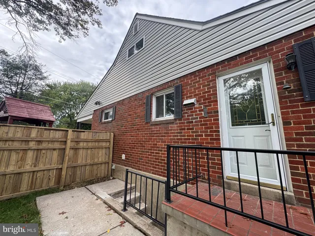 a backyard of a house with seating space