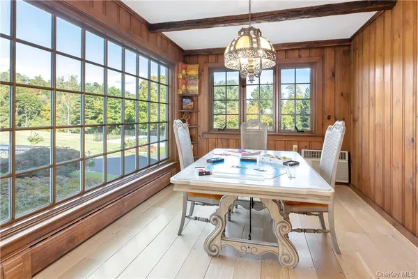 a view of a dining room with furniture window and outside view