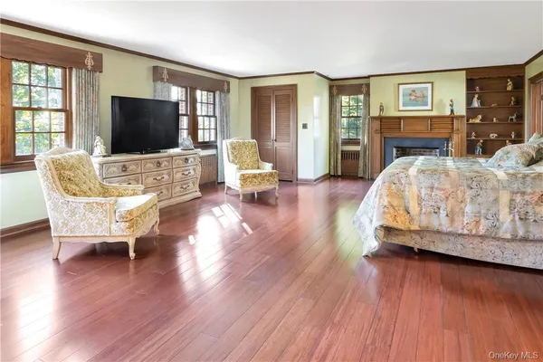 a living room with furniture fireplace and flat screen tv