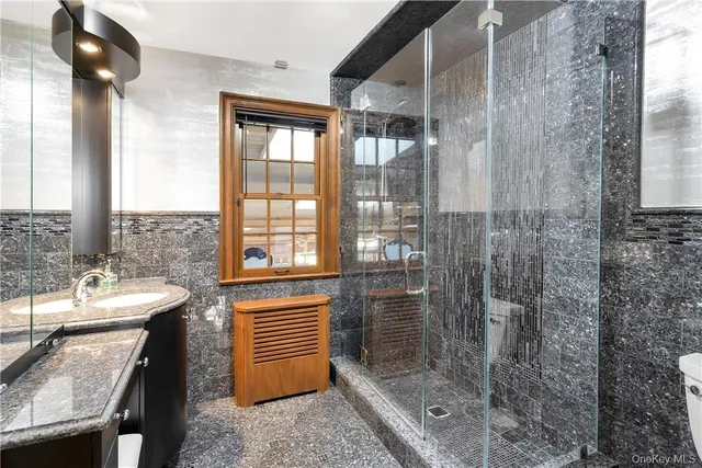 a bathroom with a shower and a sink