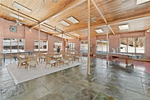 a view of a dining hall with many windows