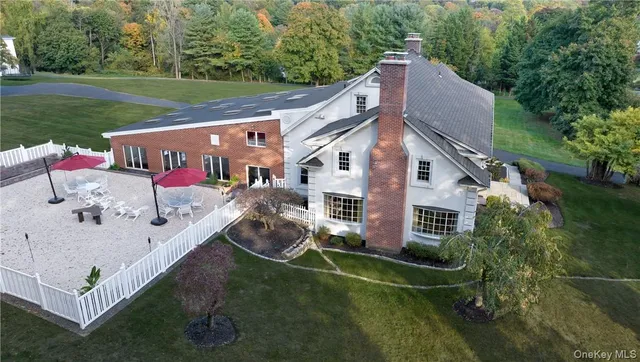 a aerial view of a house with a yard