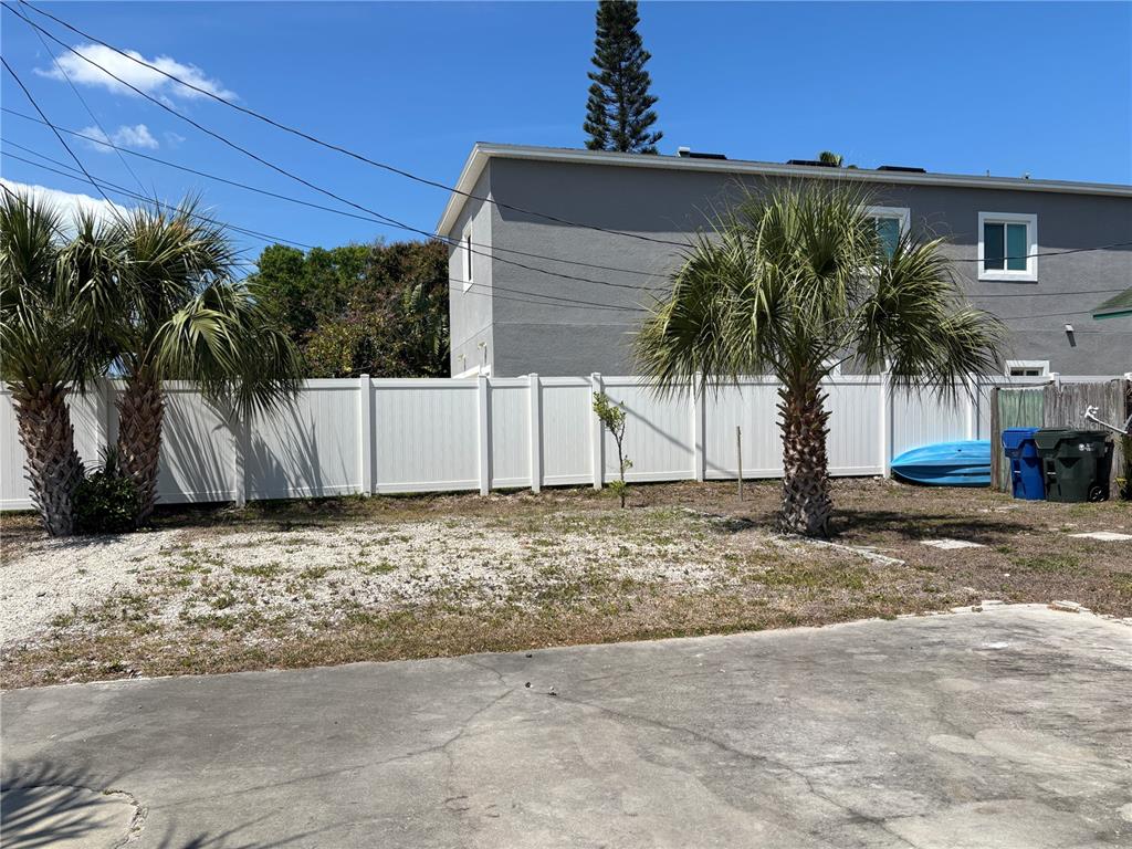 507 Cleveland Avenue Southwest, Unit 2 Largo, FL 33770 - Photo 20 of 20 a view of a house with a yard and plant