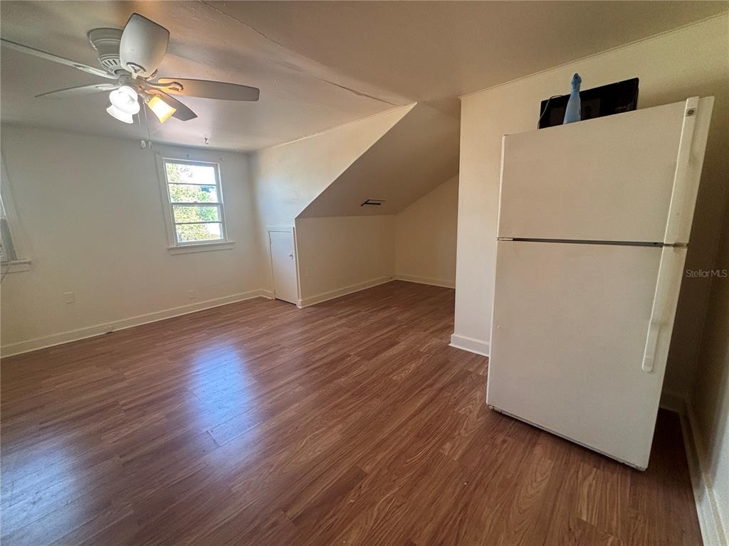 507 Cleveland Avenue Southwest, Unit 2 Largo, FL 33770 - Photo 5 of 20 a view of a livingroom with wooden floor