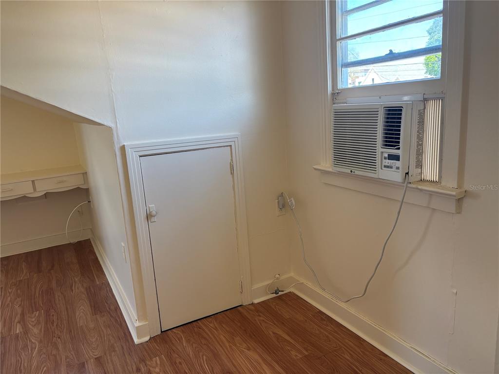 507 Cleveland Avenue Southwest, Unit 2 Largo, FL 33770 - Photo 10 of 20 a view of a room with wooden floor and a window