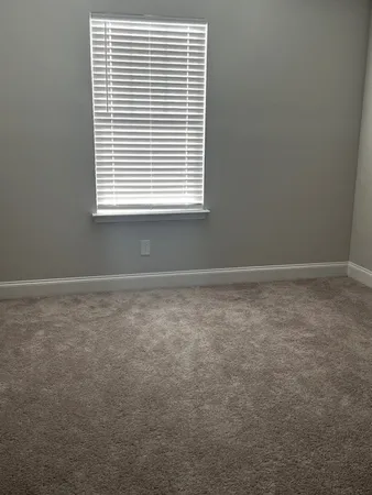a view of empty room with a window