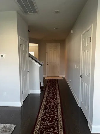 a view of a hallway view with staircase