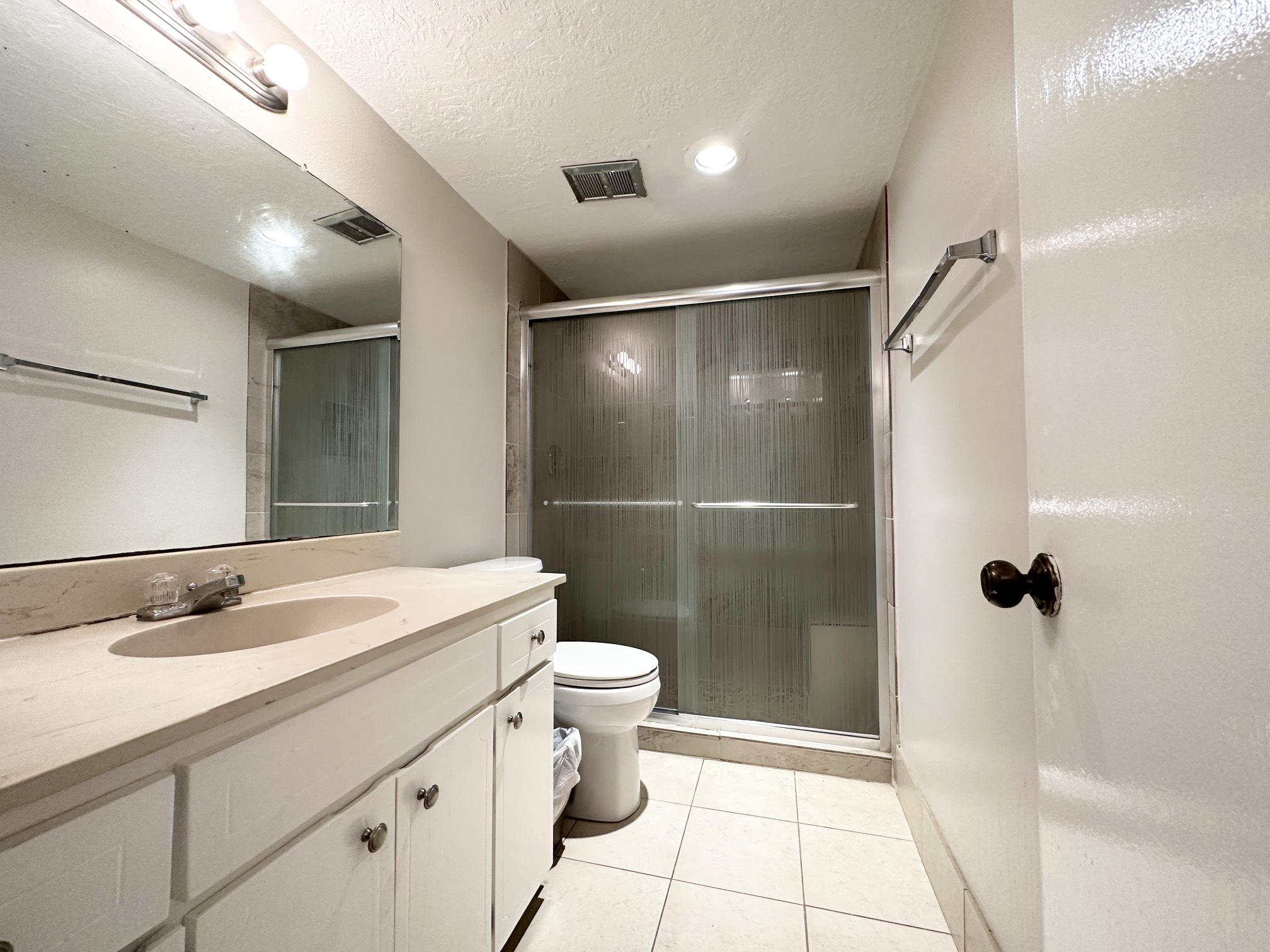 3224 Timmons Lane, Unit 154 Houston, TX 77027 - Photo 10 of 21 a bathroom with a sink toilet and shower