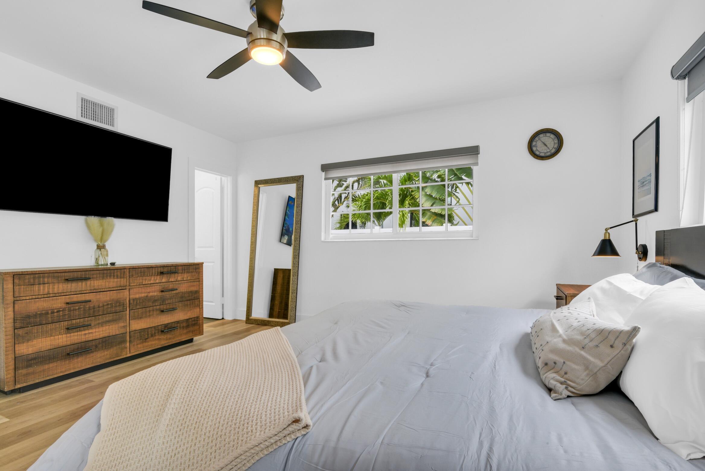 701 Appleby Street Boca Raton, FL 33487 - Photo 28 of 47 a bedroom with a bed and a flat screen tv