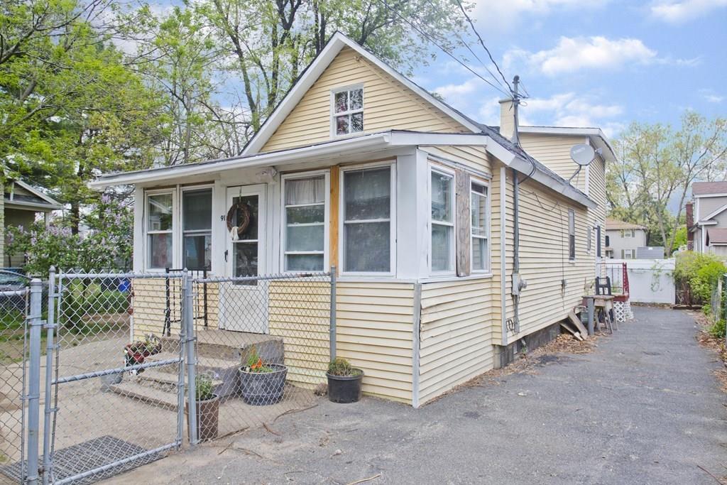 91 Penrose Street Springfield, MA 01109 - Photo 2 of 23 a view of a house with a yard and balcony