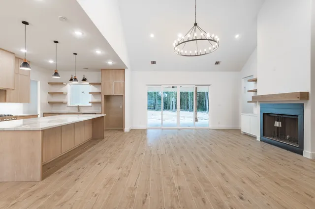 a large kitchen with stainless steel appliances kitchen island a large island in the center