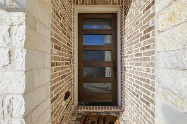 a view of a door and a window