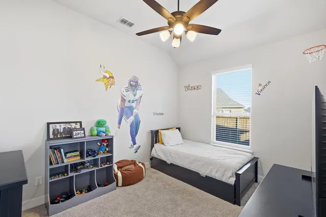 a bedroom with furniture and a window