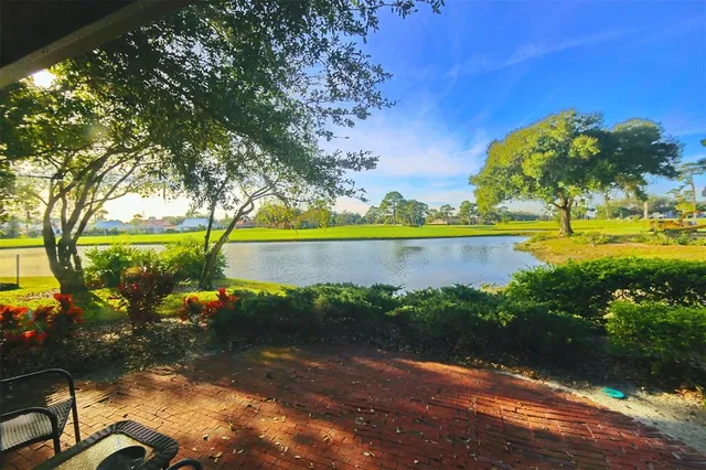 a view of a lake with a big yard