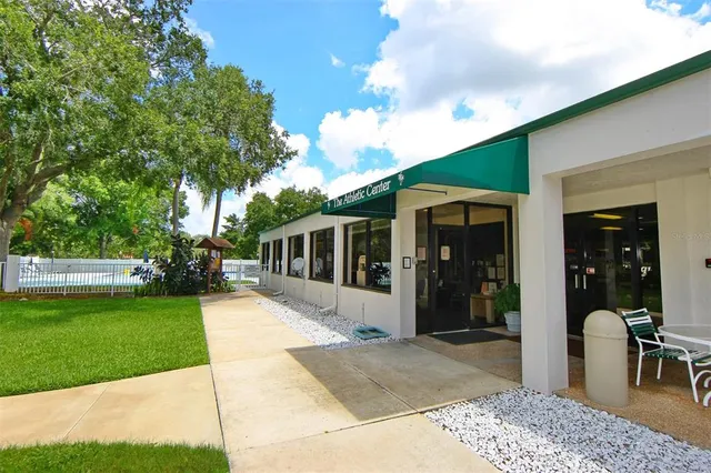 a view of a house with backyard porch and sitting area