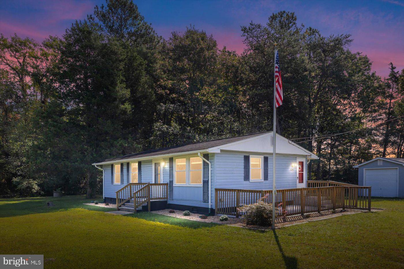 11193 Henry Griffin Road King George, VA 22485 - Photo 1 of 35 a front view of a house with a yard and trees