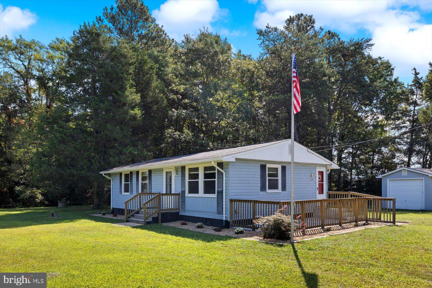 11193 Henry Griffin Road King George, VA 22485 - Photo 5 of 35 a front view of a house with a yard patio and fire pit