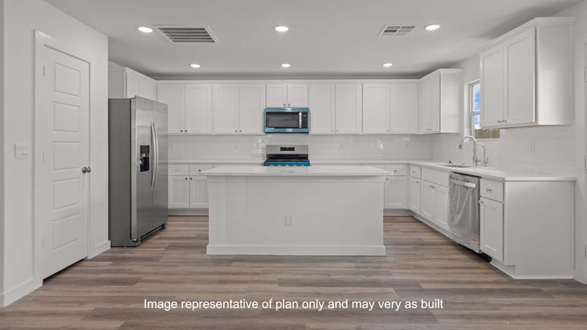 7443 9th Street Lubbock, TX 79416 - Photo 11 of 28 a kitchen with cabinets and stainless steel appliances