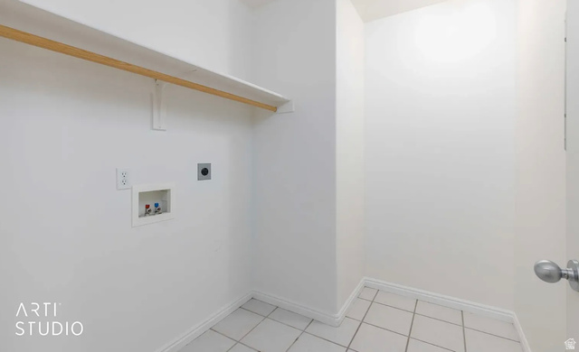 4823 Old Post Road Ogden, UT 84403 - Photo 15 of 19 Utility area featuring tile flooring, a white wall shelf, and laundry hookups