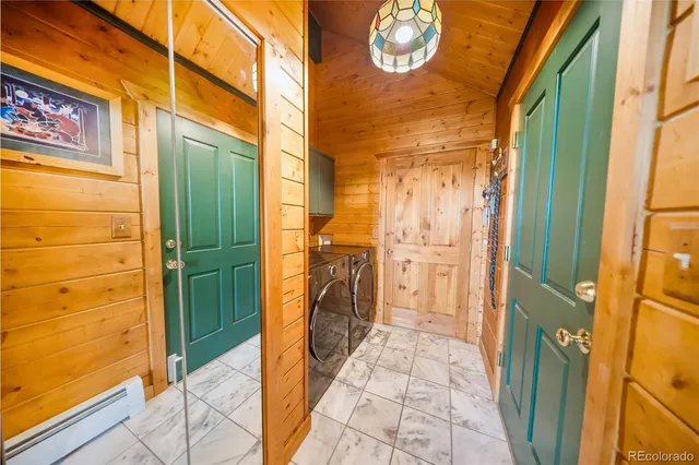 a bedroom with furniture and a large window