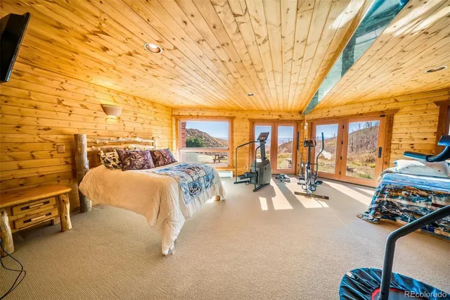 a view of a room with furniture and windows