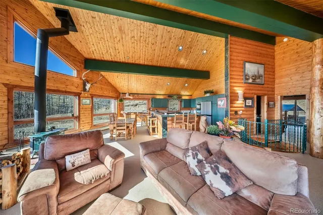 a view of a backyard with sitting area