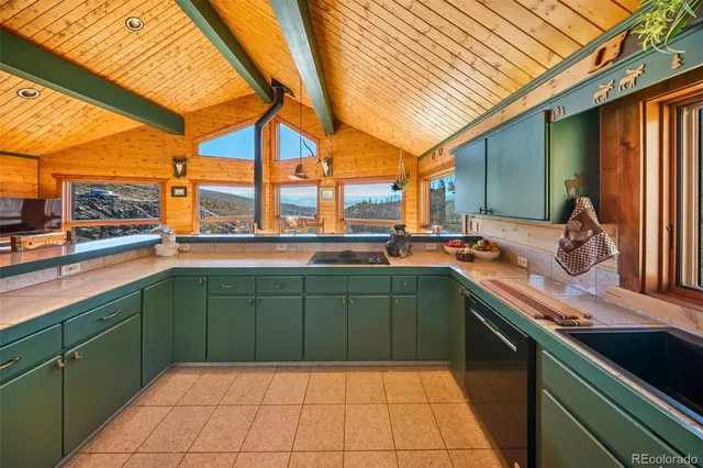 a view of a balcony with furniture and floor to ceiling windows