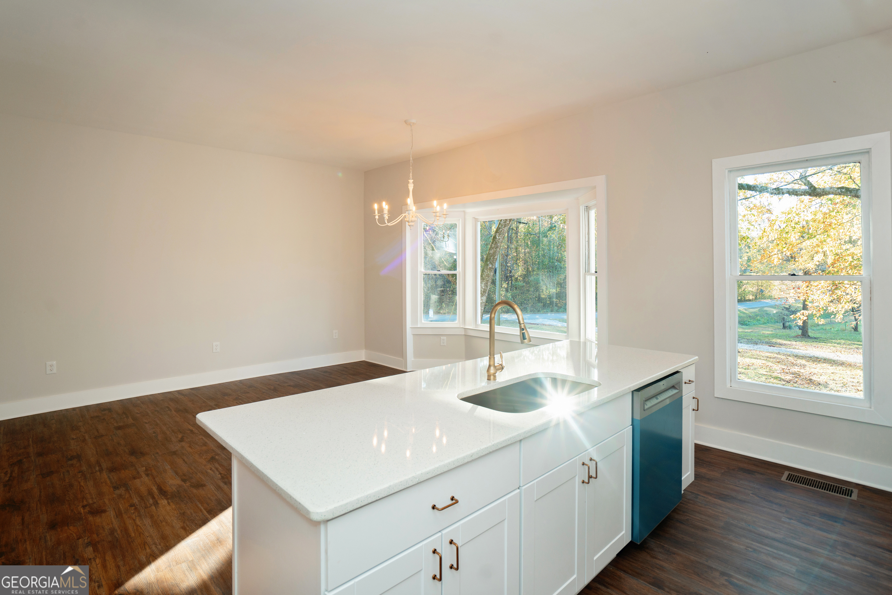 269 Martin Dairy Road Milner, GA 30257 - Photo 18 of 71 a kitchen with a sink cabinets and wooden floor
