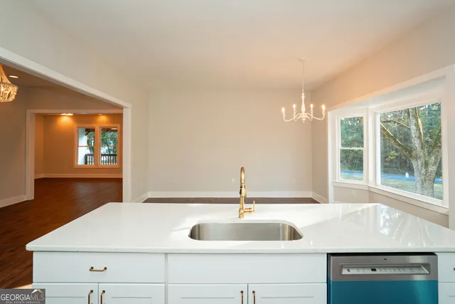 a view of a room with wooden floor and window
