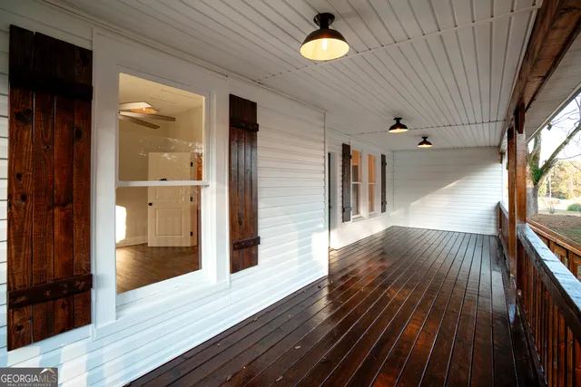 a view of a hallway and wooden floor